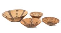 Four California Baskets Height of largest 5 1/2 x diameter 19 inches