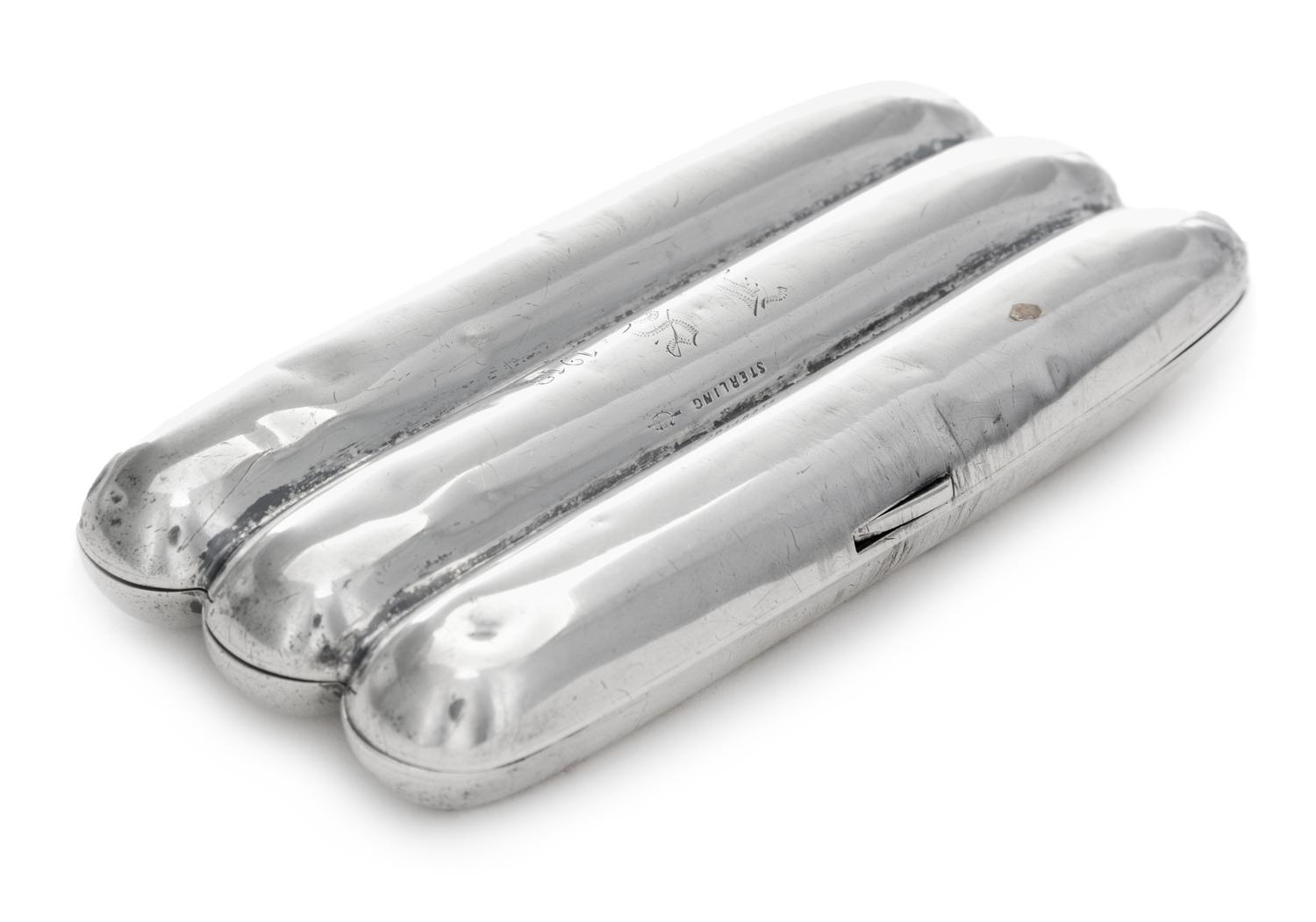 A Silver Cigar Case, , in the form of three cigars, initialed and dated 1913