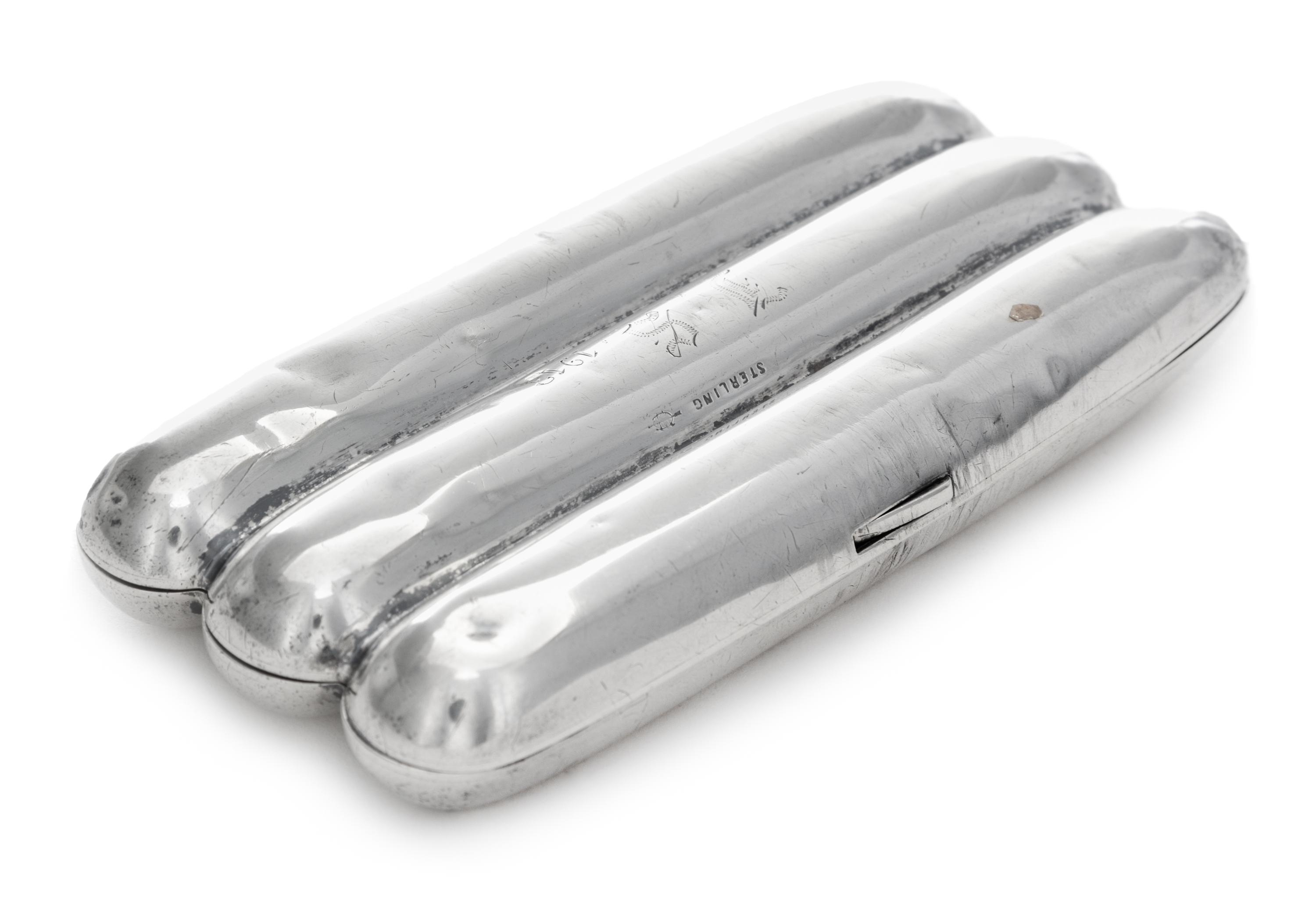 A Silver Cigar Case, , in the form of three cigars, initialed and dated 1913