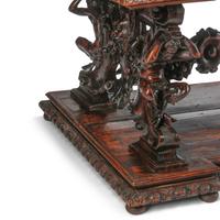 An Italian Renaissance Revival Carved Walnut Library Table
