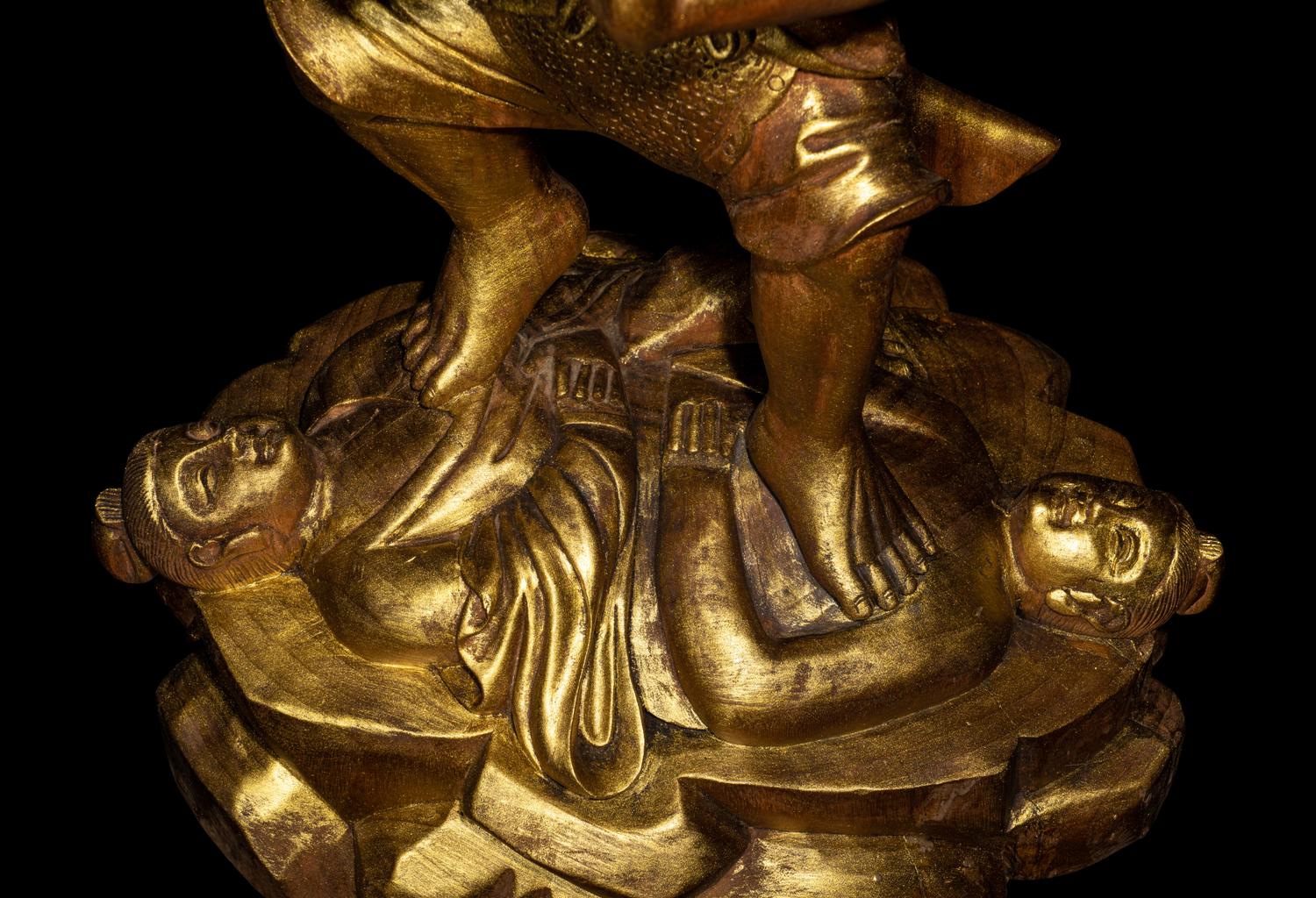 A Chinese Gilt Lacquered Wood Figure of a Deity