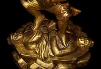 A Chinese Gilt Lacquered Wood Figure of a Deity