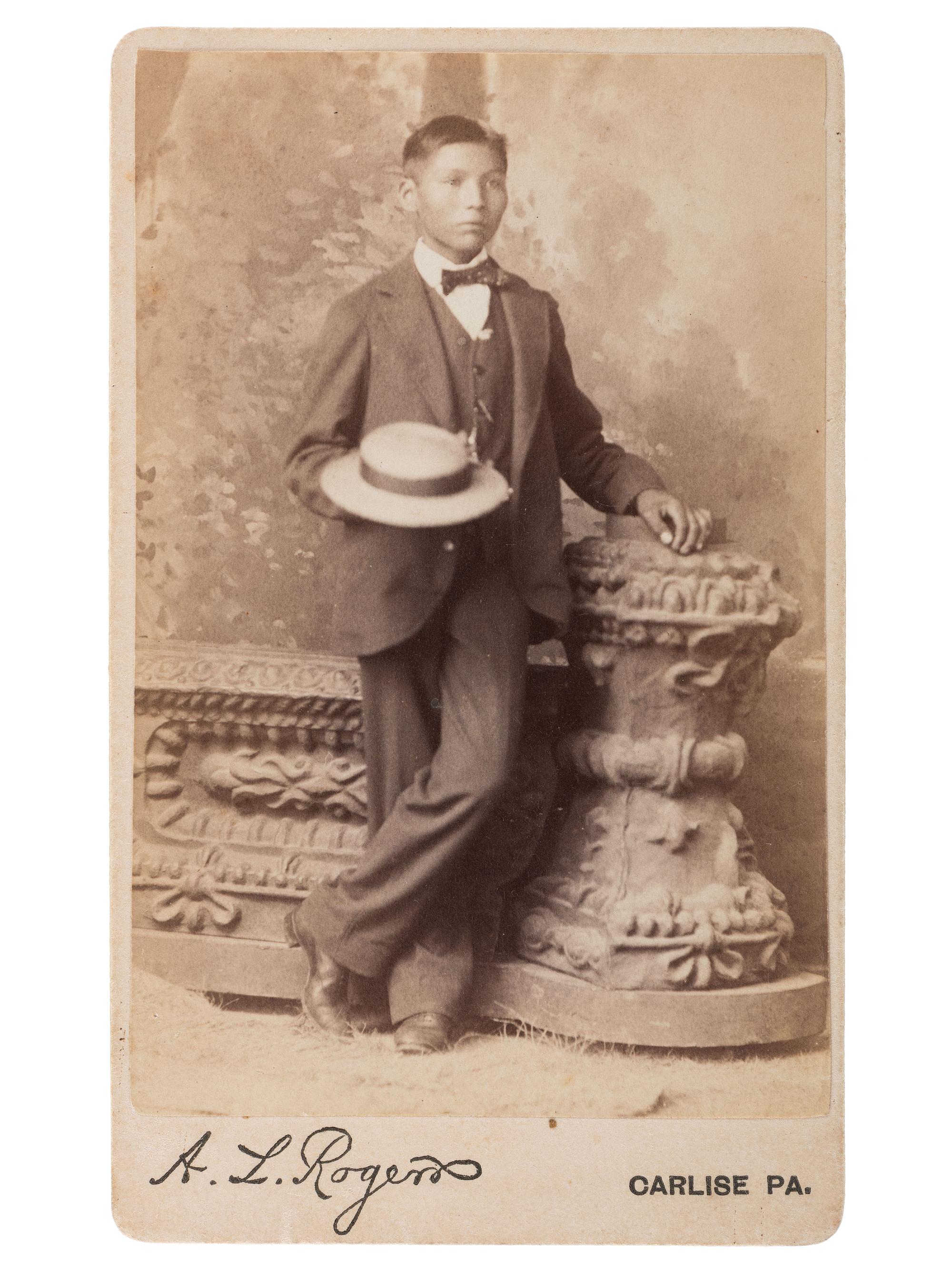 [NATIVE AMERICANS]. ROGERS, A.L., photographer. CDV of Samuel H. Johns, a Nez Perce student at the Carlisle Indian School. Carlisle, PA: ca 1885.