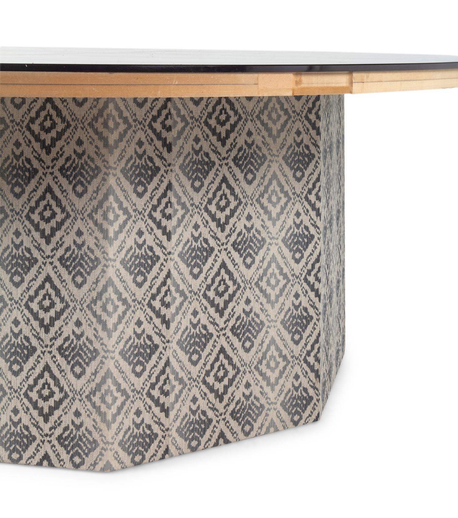 A Contemporary Octagonal Upholstered Dining Table Base with a Circular Glass Top