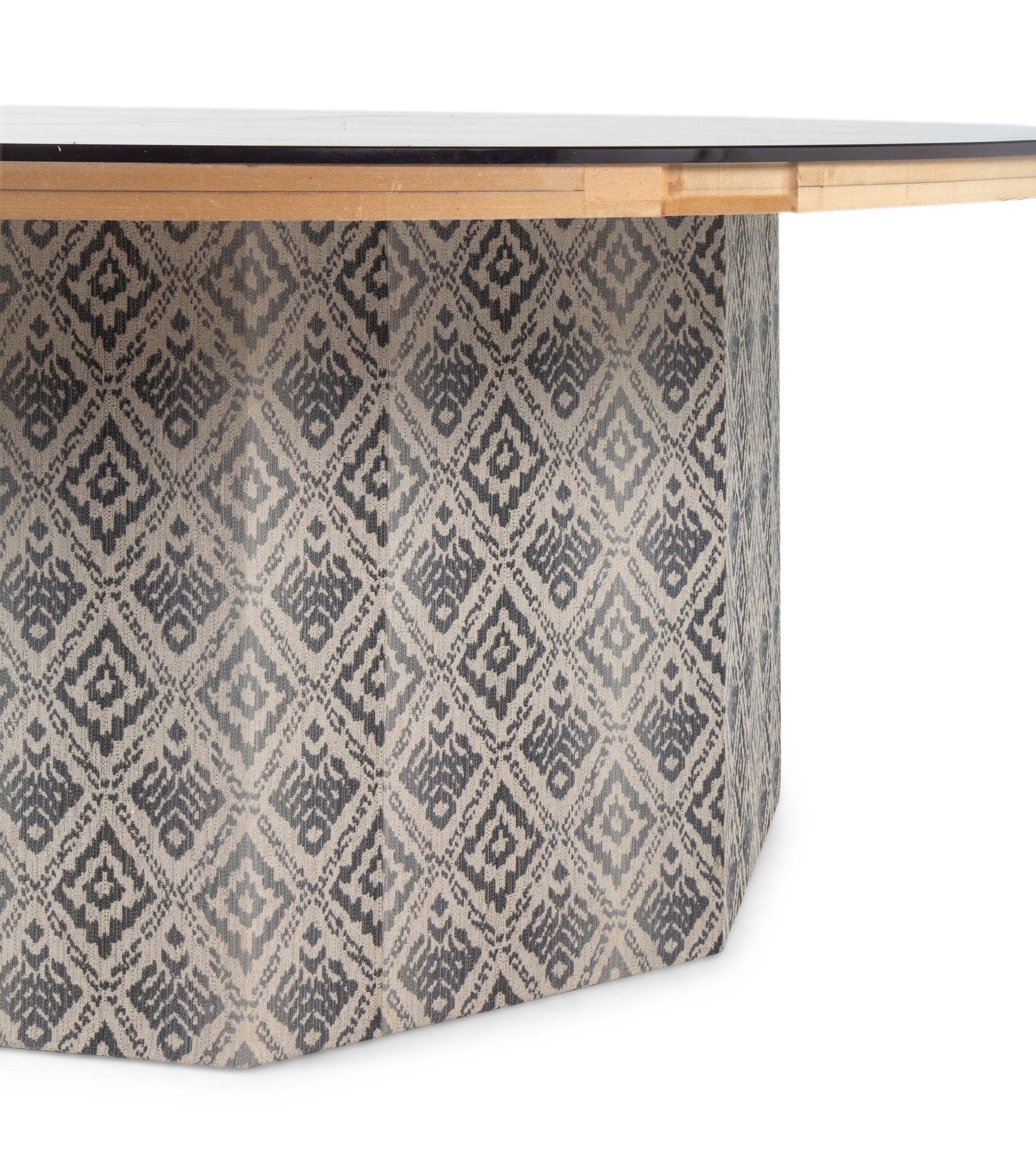 A Contemporary Octagonal Upholstered Dining Table Base with a Circular Glass Top