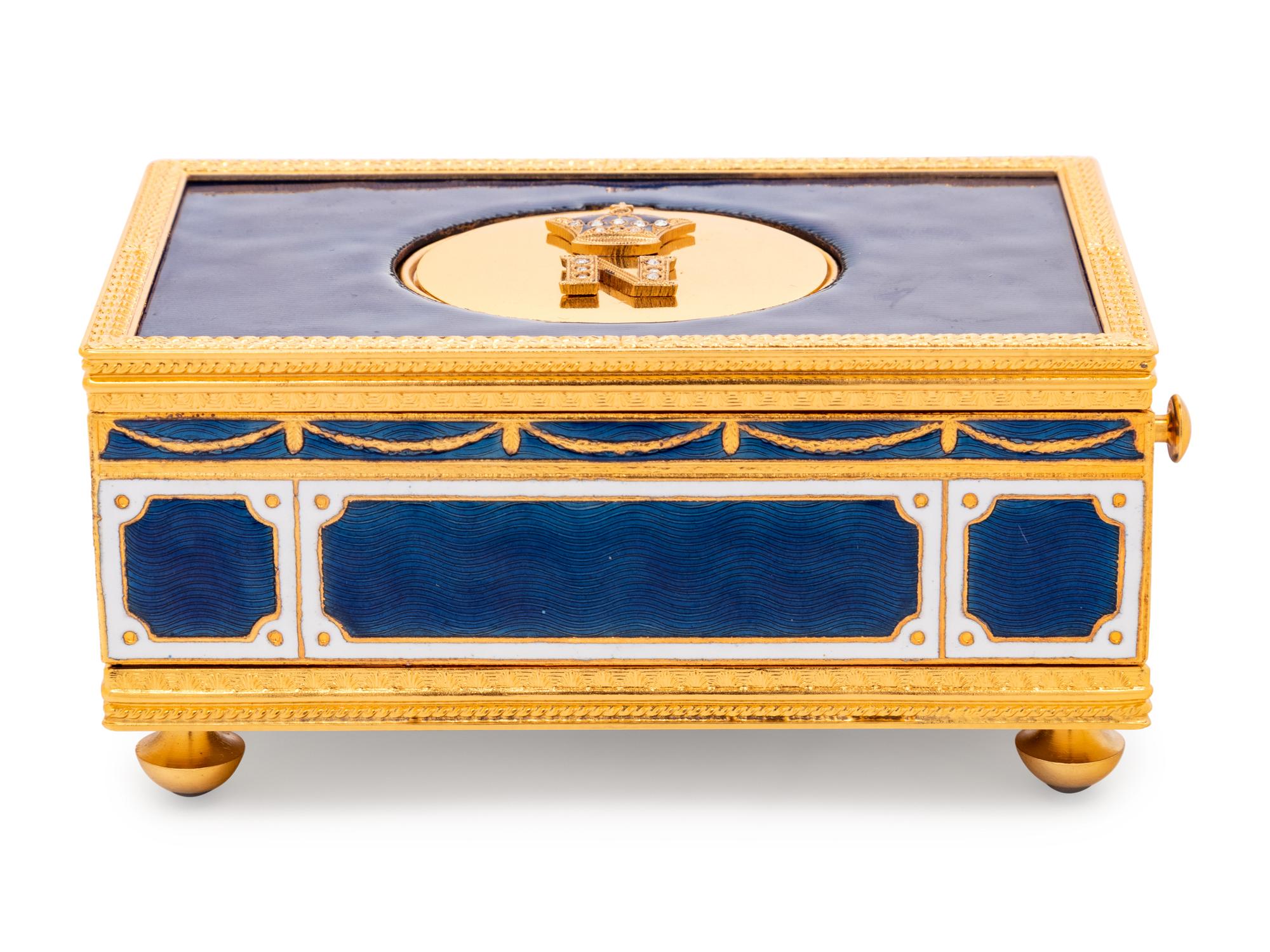 A Reuge Gilt Metal Mounted and Rhinestone-Inset Enameled Singing Bird Automaton Box