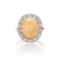 A 14 Karat Gold, Opal and Diamond Ring, 3.60 dwts.