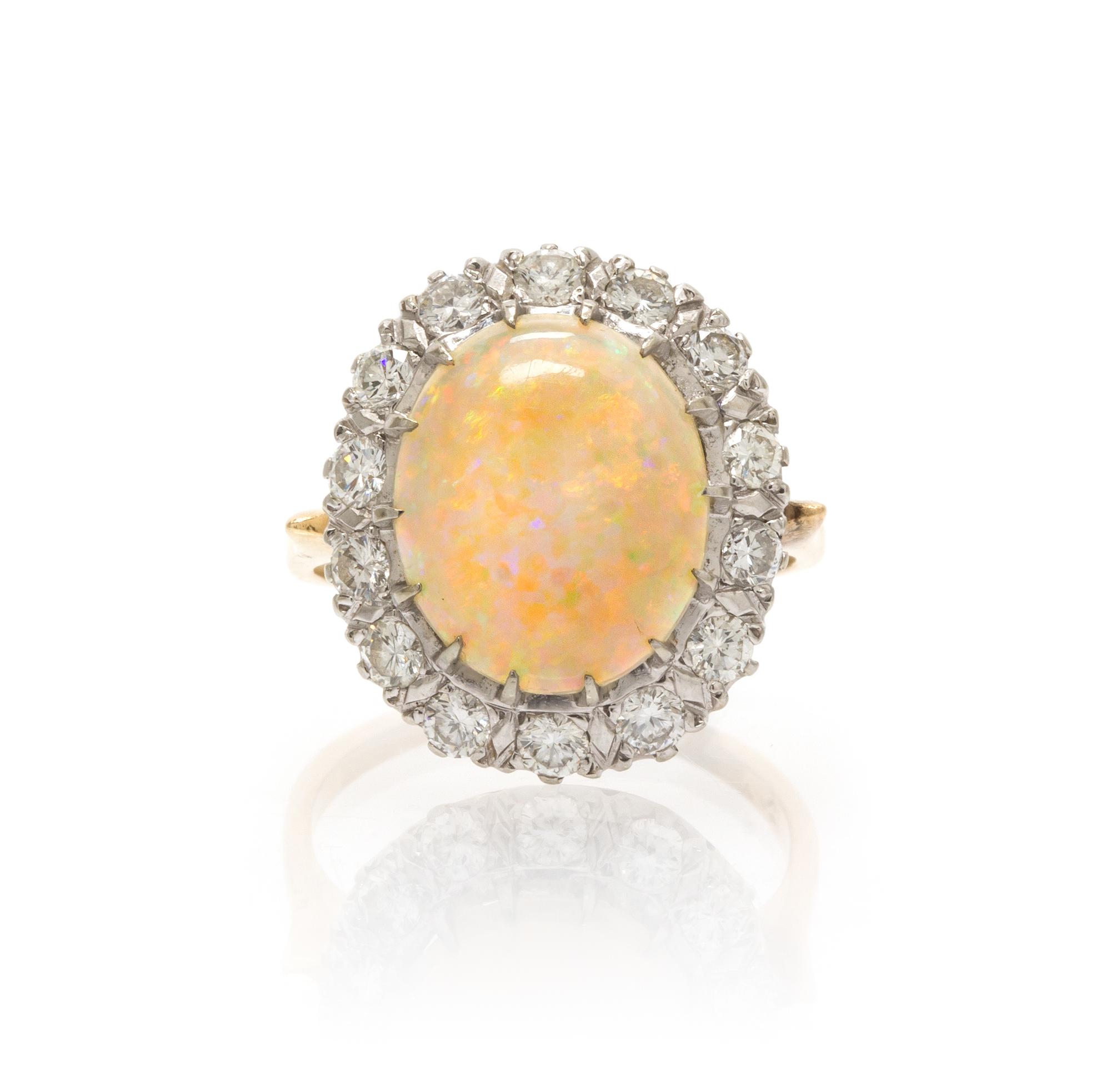 A 14 Karat Gold, Opal and Diamond Ring, 3.60 dwts.