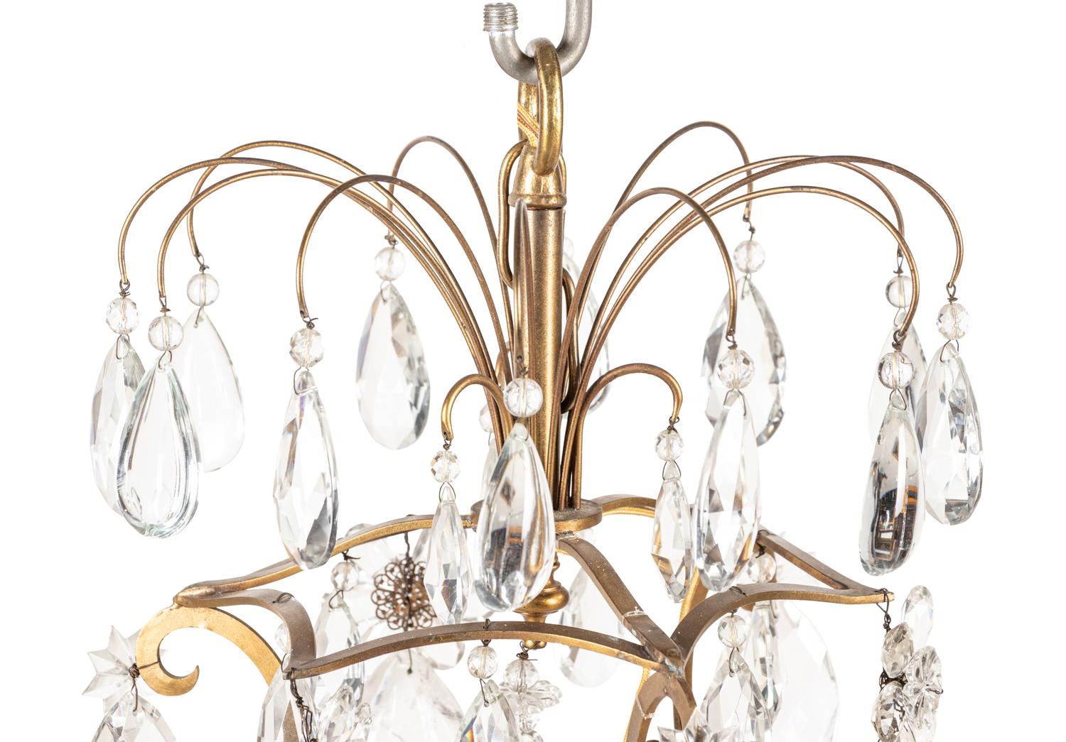 A French Gilt Bronze and Rock Crystal Six-Light Chandelier