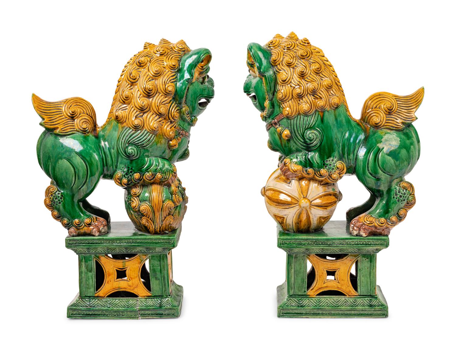 A Pair of Chinese Sancai Glazed Porcelain Figures of Fu Lions