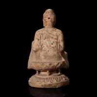 A Chinese carved white marble figure of Buddha seated