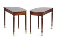 A Pair of Federal Brass-Mounted, Carved and Crossbanded Mahogany Console Tables