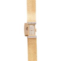 TIFFANY & CO., 14K YELLOW GOLD AND DIAMOND SURPRISE WATCH