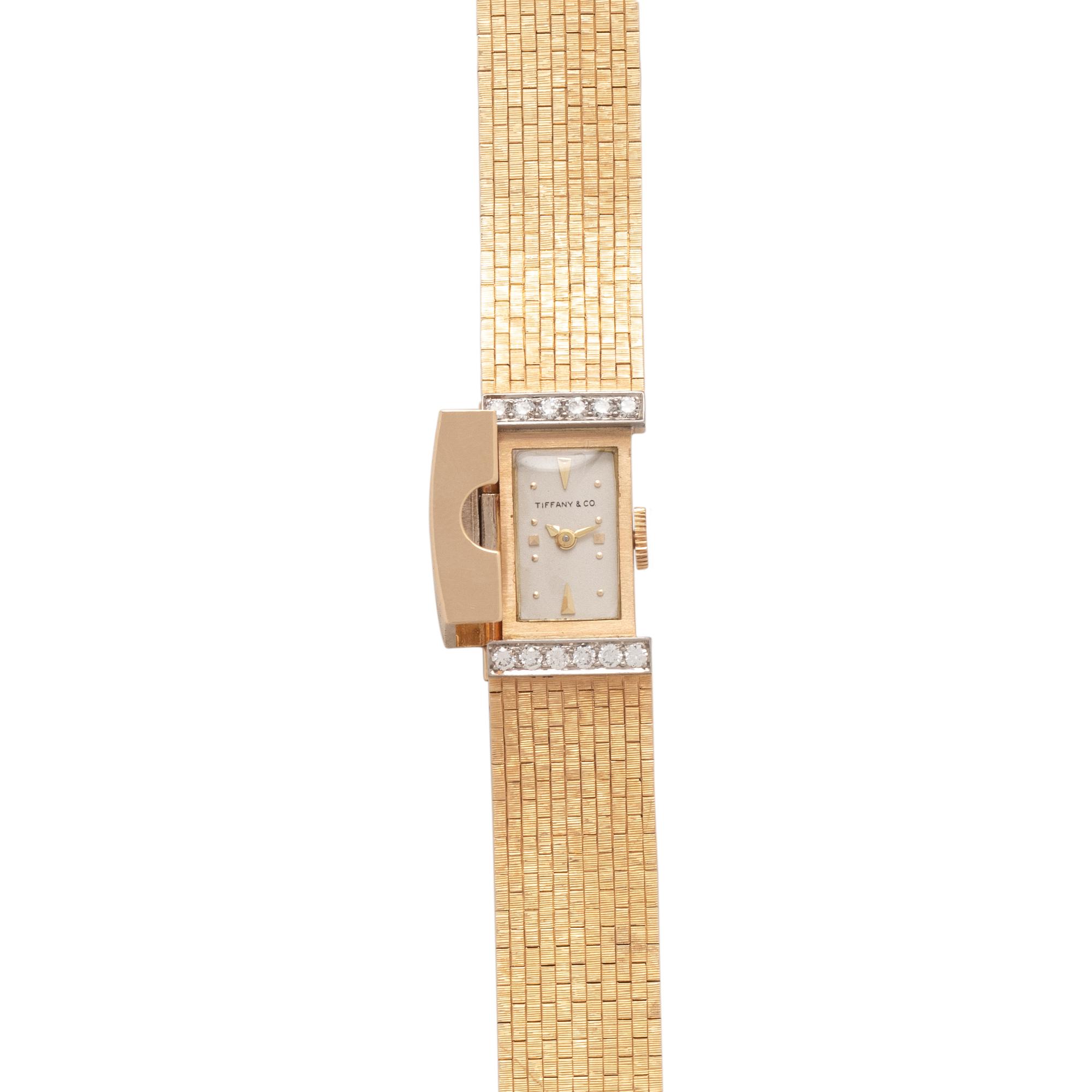TIFFANY & CO., 14K YELLOW GOLD AND DIAMOND SURPRISE WATCH