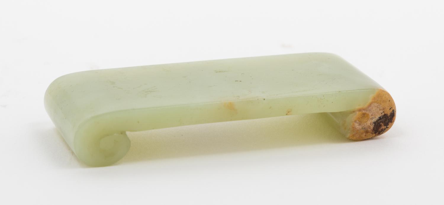A Carved Jade Stand Height 1/2 x width 3 x depth 1 1/4 inches.