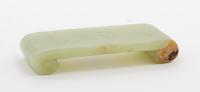 A Carved Jade Stand Height 1/2 x width 3 x depth 1 1/4 inches.