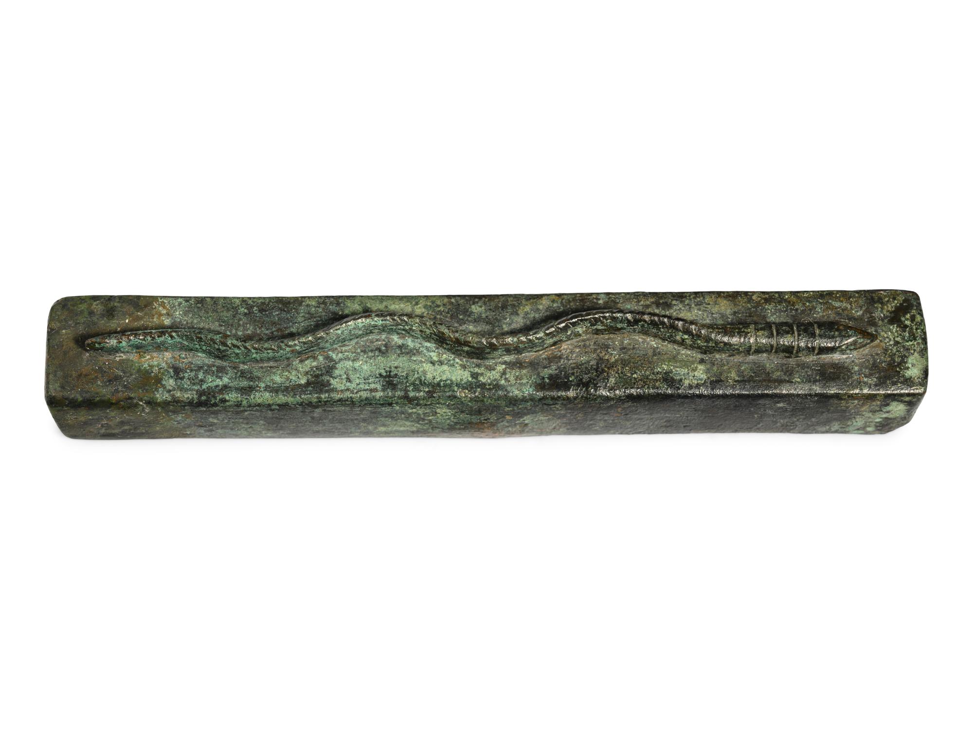 An Egyptian Bronze Snake Coffin