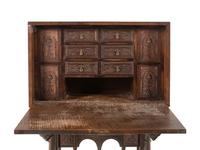A Spanish Baroque Style Walnut Vargueño and Stand