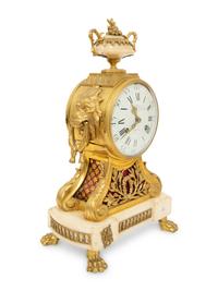 A Louis XVI Gilt Bronze and Marble Mantel Clock
