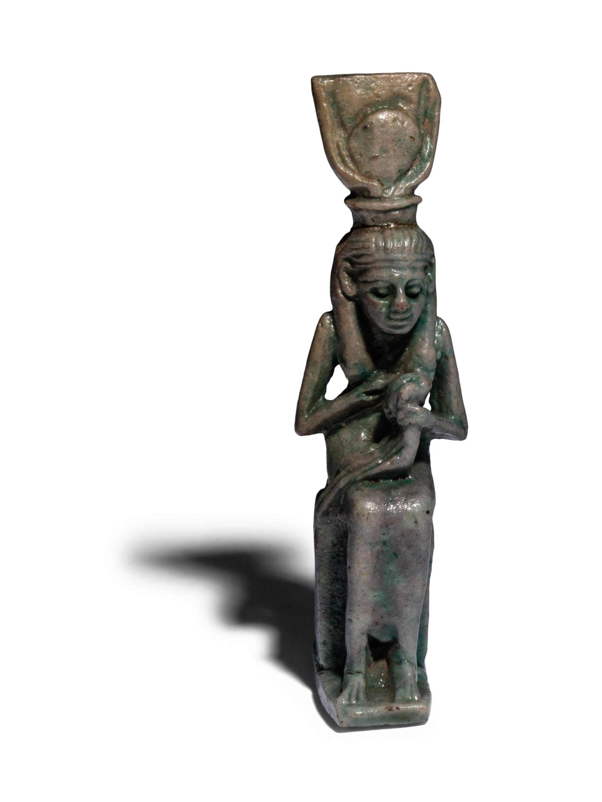 An Egyptian Faience Isis Nursing Horus Amulet