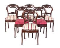 A Set of Six Victorian Balloon Back Chairs Height 34 inches.