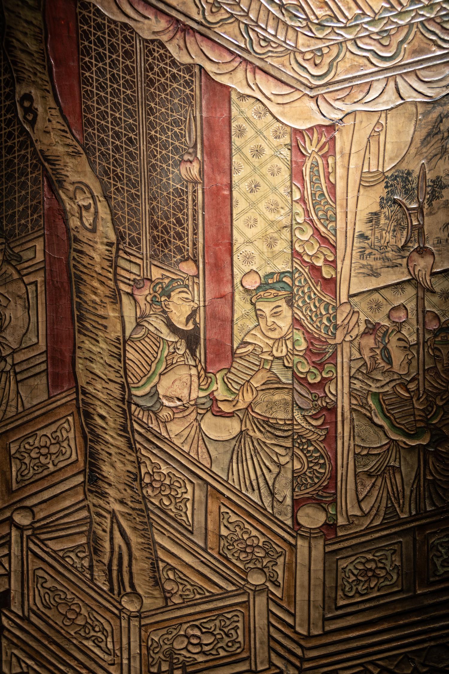 A Coromandel Lacquer Eight-Panel Floor Screen