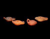 Four Roman Molded Terra Cotta Oil Lamps