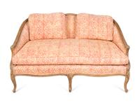 A French Provincial Carved Fruitwood Settee — 20TH CENTURY