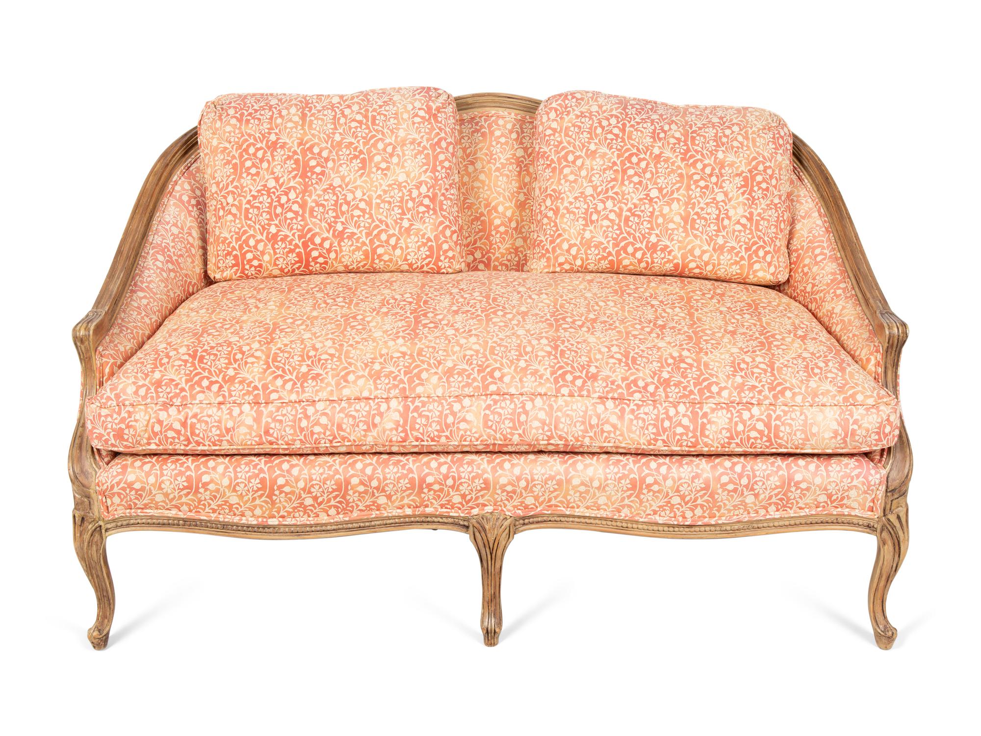 A French Provincial Carved Fruitwood Settee — 20TH CENTURY