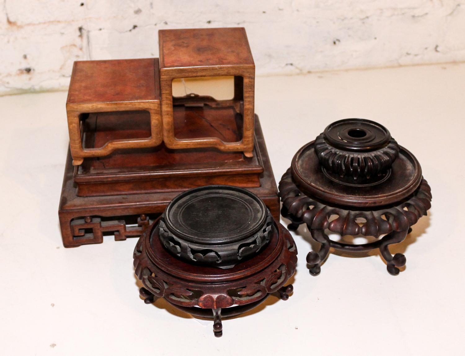 A Collection of Seventeen Hardwood Stands Height of largest 3 1/4 x width 9 5/8 x depth 7 7/8 inches.