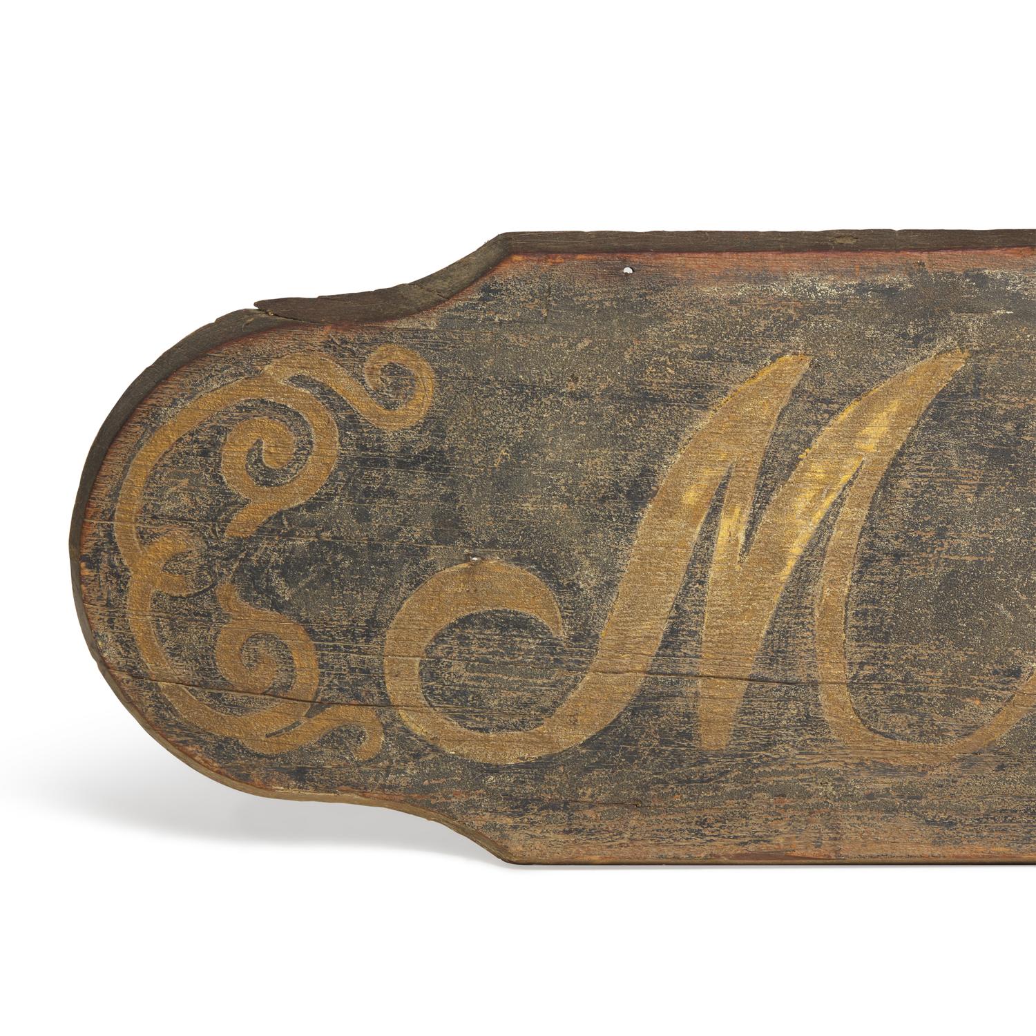 A Painted Wood "Millinery" Trade Sign