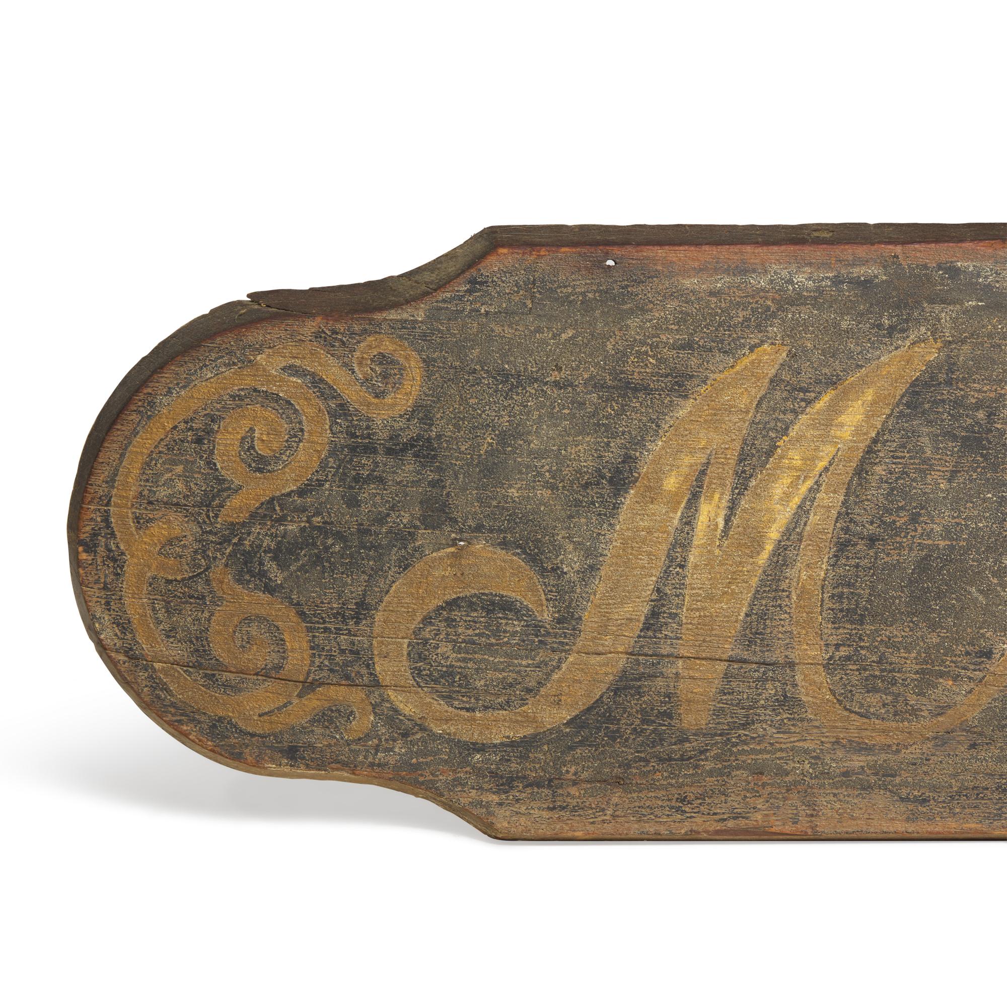 A Painted Wood "Millinery" Trade Sign