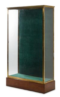 A French Brass and Glass Shop Vitrine Height 71 x width 16 1/4 x depth 42 1/2 inches. — CIRCA 1910