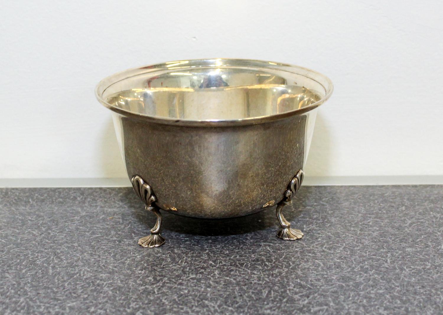 An American Silver Bowl, Georg Jensen USA, New York, NY, having an out turned rim and raised on three foliate form feet.