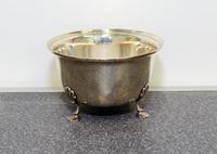 An American Silver Bowl, Georg Jensen USA, New York, NY, having an out turned rim and raised on three foliate form feet.