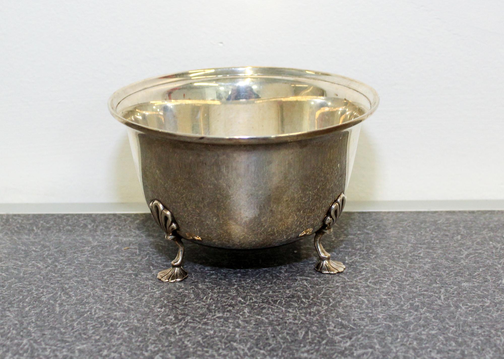 An American Silver Bowl, Georg Jensen USA, New York, NY, having an out turned rim and raised on three foliate form feet.