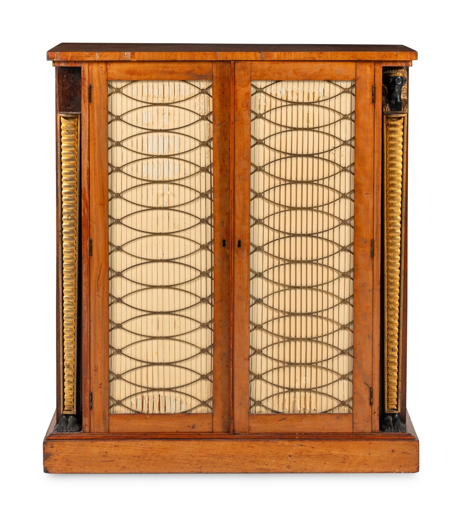A Regency Satinwood, Part Ebonized and Parcel Gilt Cabinet