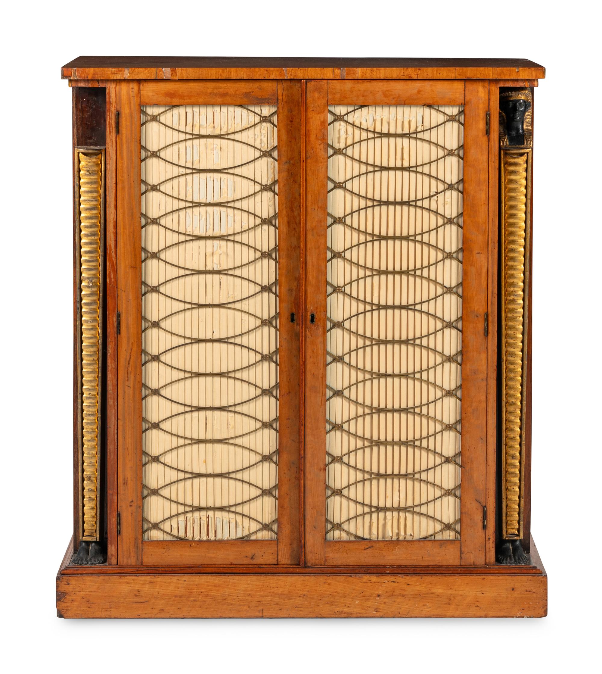 A Regency Satinwood, Part Ebonized and Parcel Gilt Cabinet