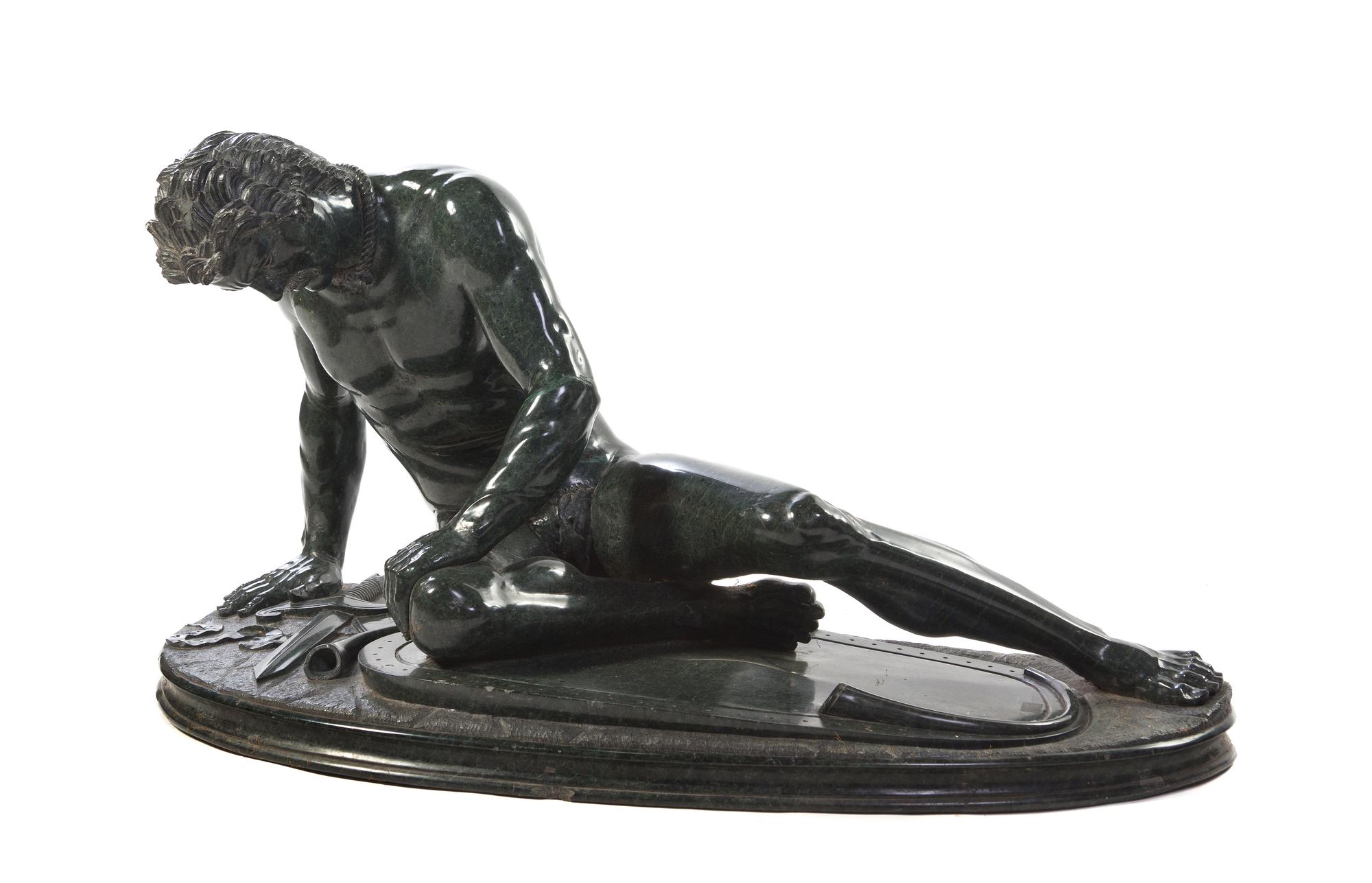 A Continental Carved Marble Figure, after the Antique, Width overall 41 inches.