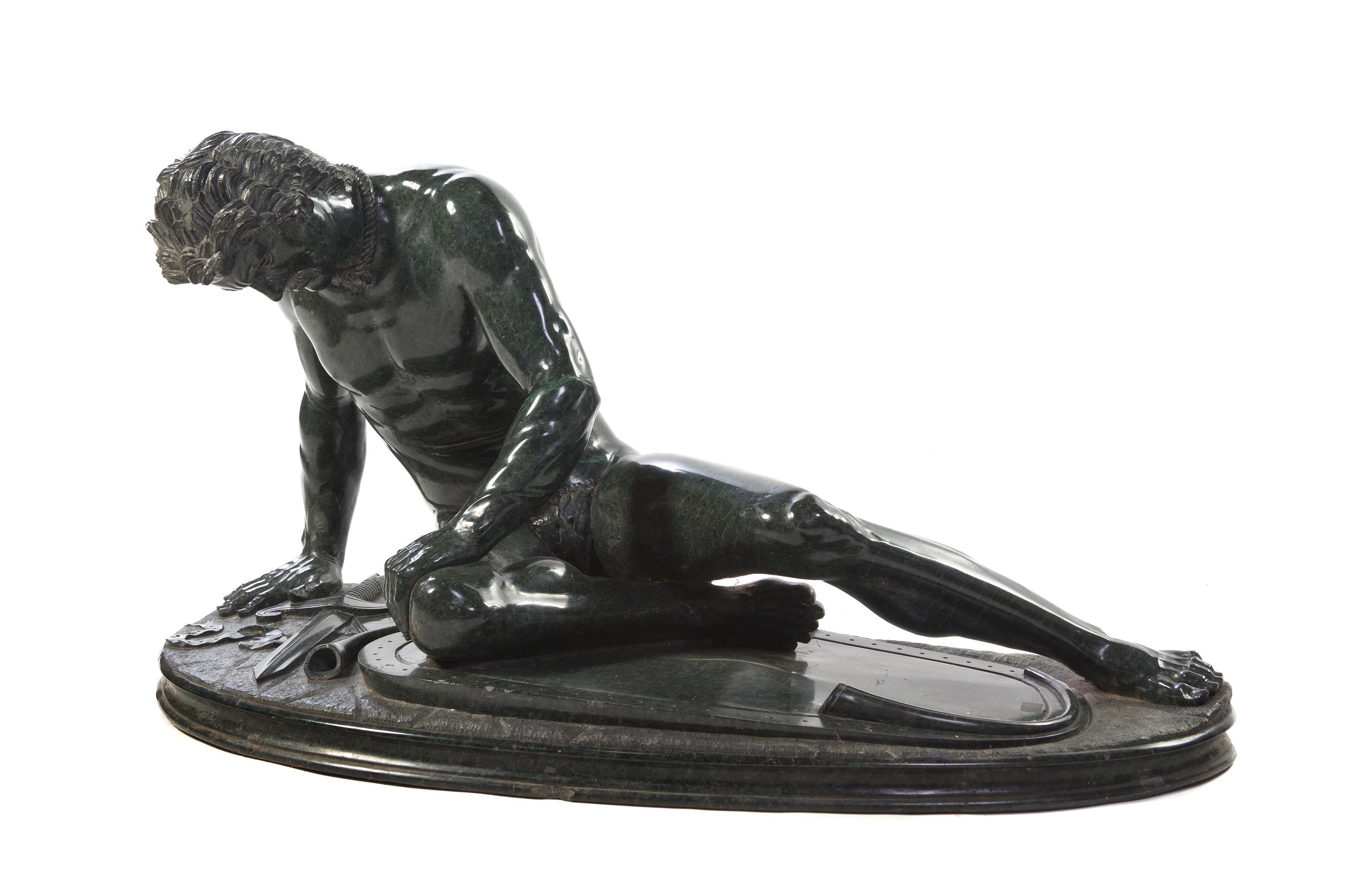 A Continental Carved Marble Figure, after the Antique, Width overall 41 inches.