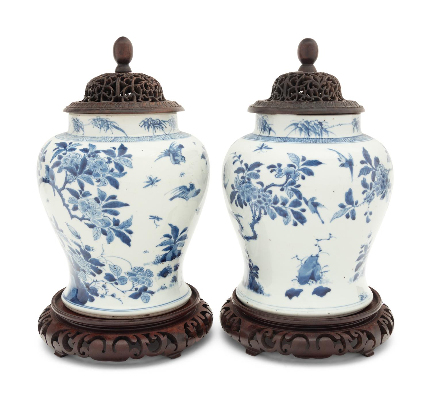 A Pair of Chinese Blue and White Porcelain Ginger Jars with Pierced Wood Lids and Stands