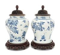 A Pair of Chinese Blue and White Porcelain Ginger Jars with Pierced Wood Lids and Stands