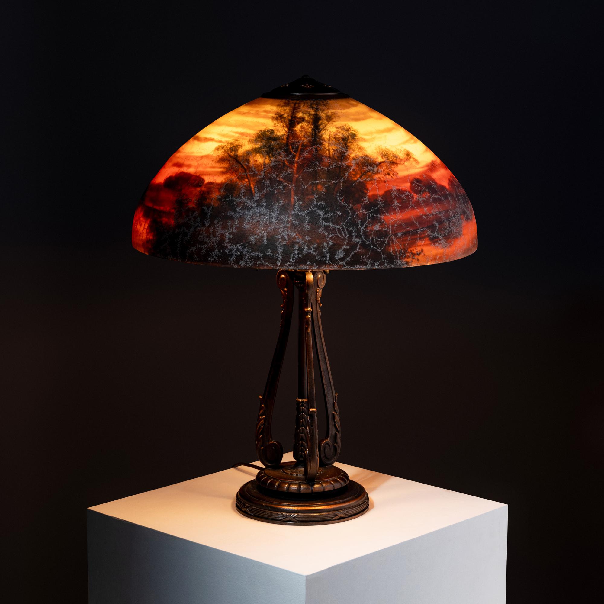 Reverse-painted glass table lamp, wooded landscape