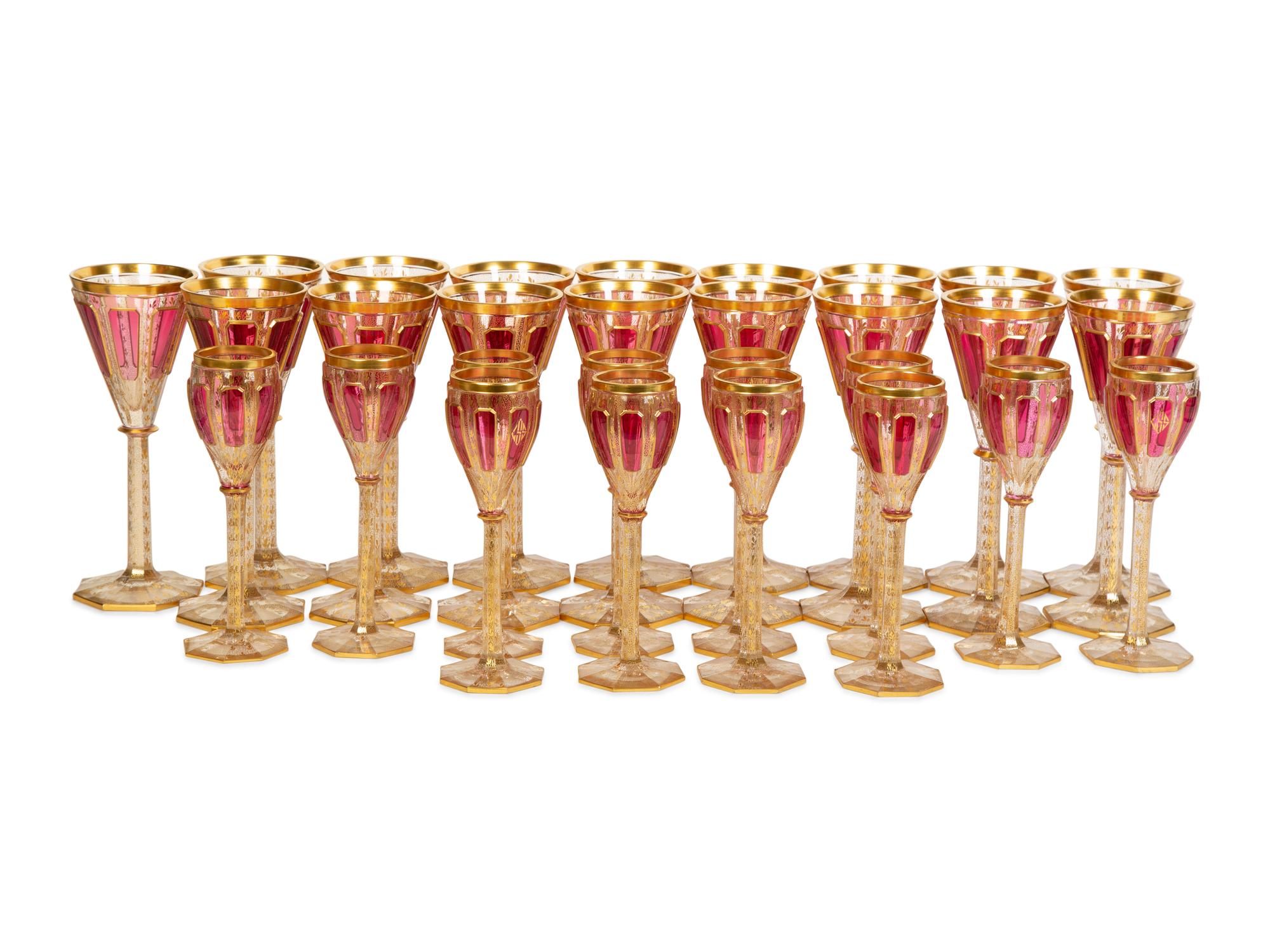 A Set of Bohemian Gilt Decorated Glass Stemware