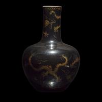 A Large Chinese Gilt-Decorated Black Glazed 'Dragon' Vase, Tianqiuping 黑地描金龍紋天球瓶