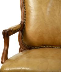 A French Provincial Style Leather Upholstered Fauteuil — 19TH CENTURY