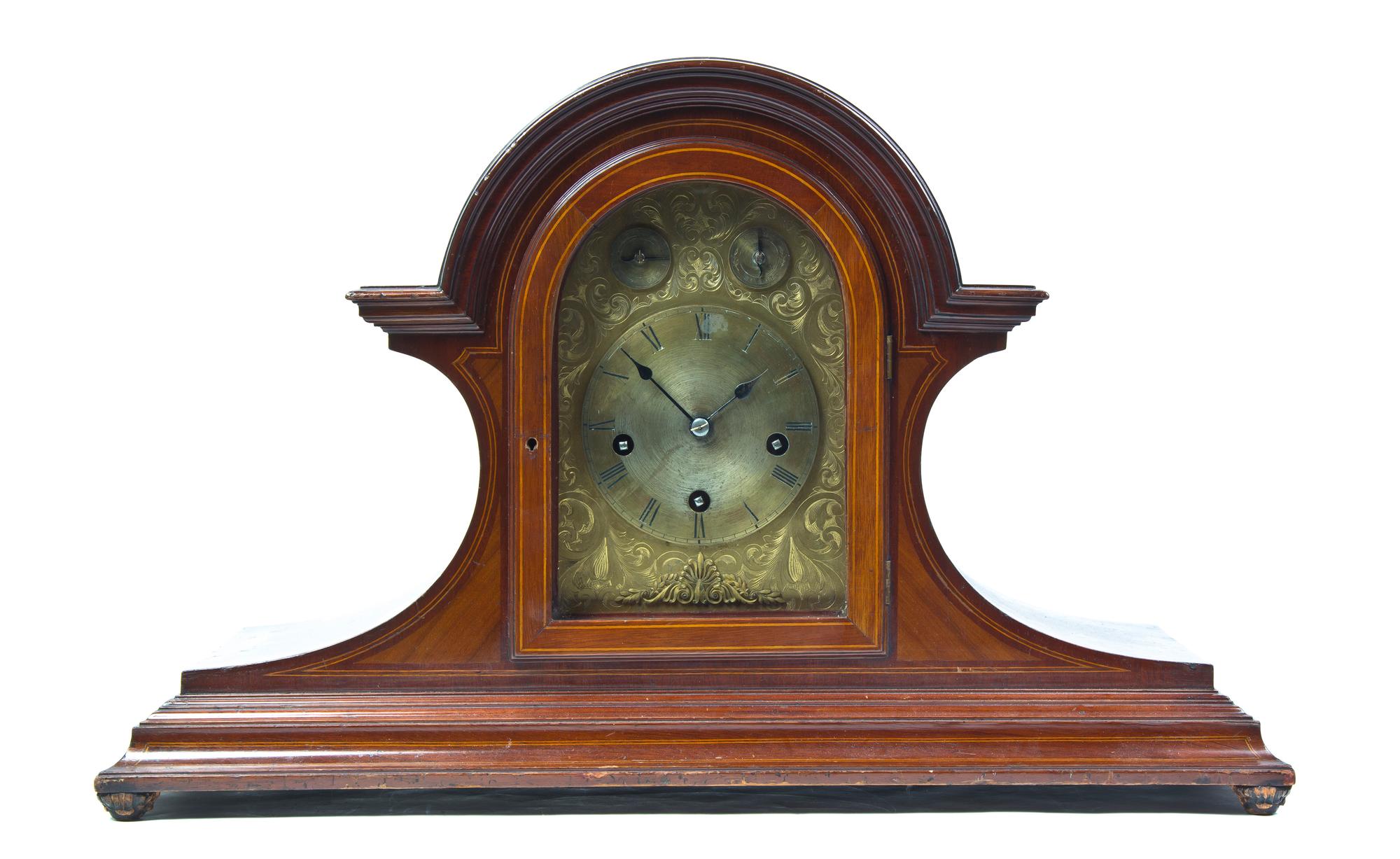 A Continental Mahogany Oversized Mantel Clock, Height 17 1/4 x width 27 1/2 inches.
