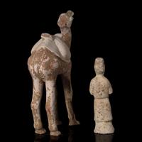 A Chinese Painted Pottery Figure of a Camel and A Pottery Figure of an Attendant, Tang Dynasty 唐 彩陶駱駝及男佣各一