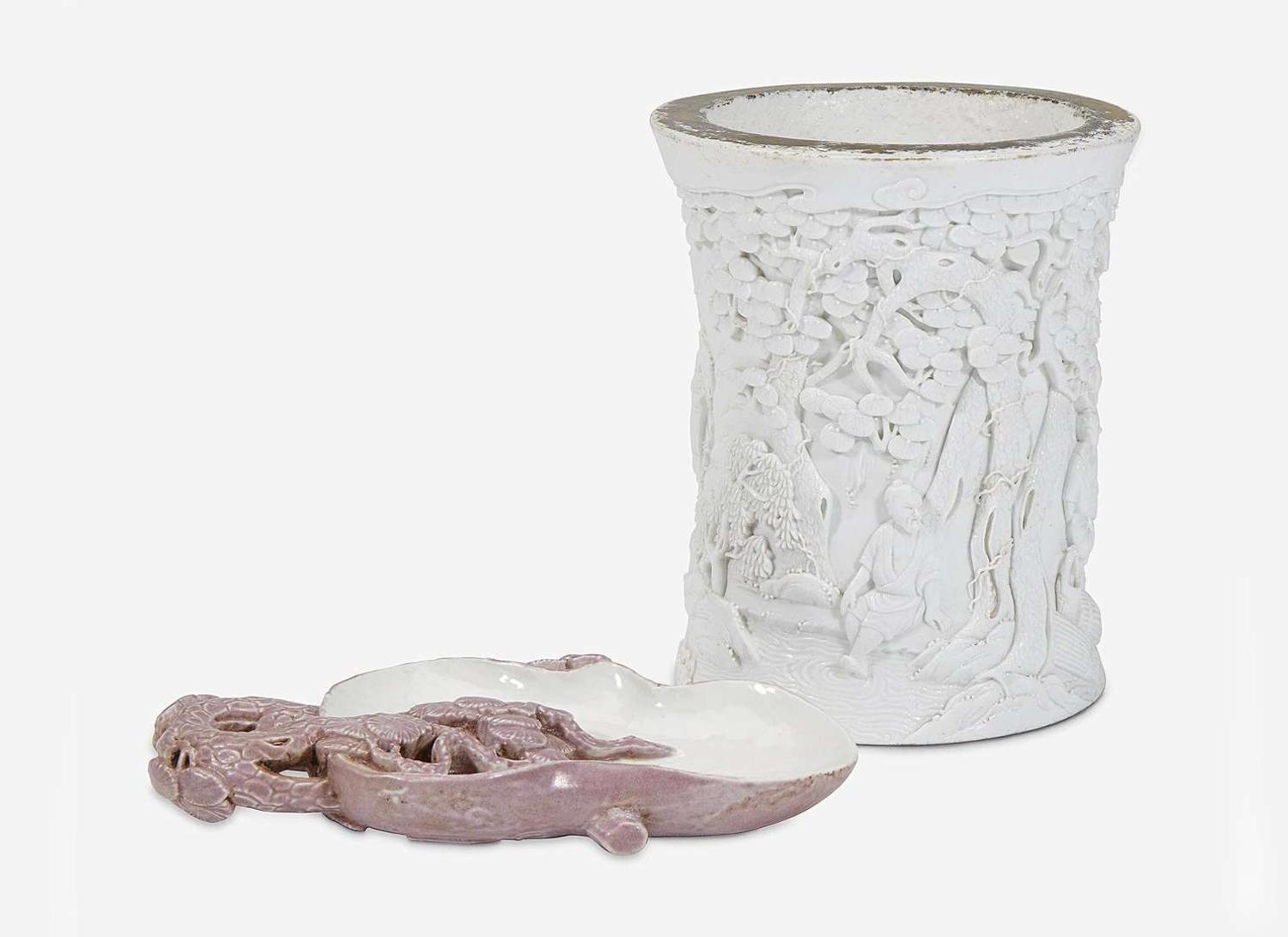 A Chinese molded and carved porcelain 'Pine' brushwasher and a "Workmen in a Landscape" brush pot, bearing mark of Wang Bingrong 瓷塑筆筒及筆洗 王炳榮款