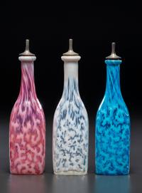 Three Coral Opalescent Glass Barber's Bottles